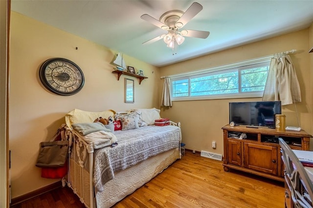 310 Smith Rd, Lebanon, MO 65536 - bedroom with baseboards, wood finished floors, and ceiling fan