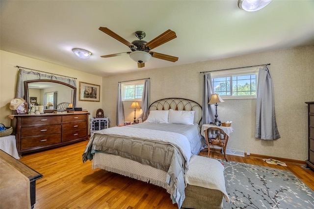 310 Smith Rd, Lebanon, MO 65536 - bedroom featuring light wood-style floors, ceiling fan, and baseboards