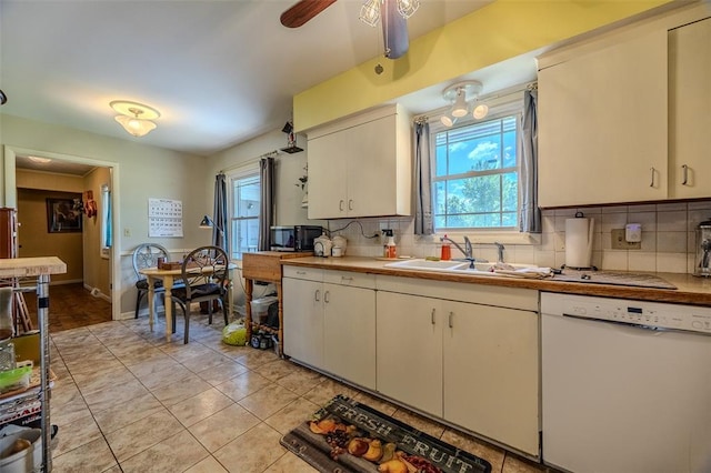 310 Smith Rd, Lebanon, MO 65536 - kitchen featuring dishwasher, a sink, decorative backsplash, ceiling fan, and light tile patterned flooring