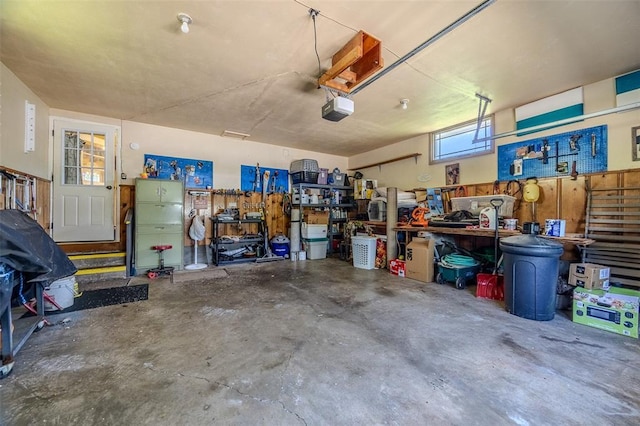 310 Smith Rd, Lebanon, MO 65536 - garage with a workshop area and a garage door opener
