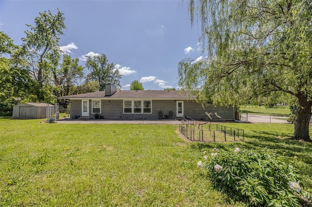 310 Smith Rd, Lebanon, MO 65536 - rear view of property with a storage unit, a patio, and an outdoor structure