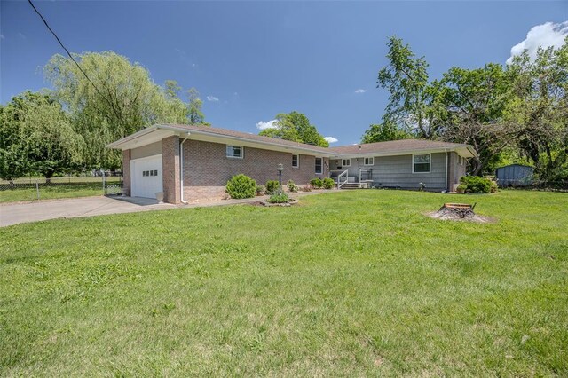 310 Smith Rd, Lebanon, MO 65536 - view of front of property featuring a garage, driveway, and brick siding