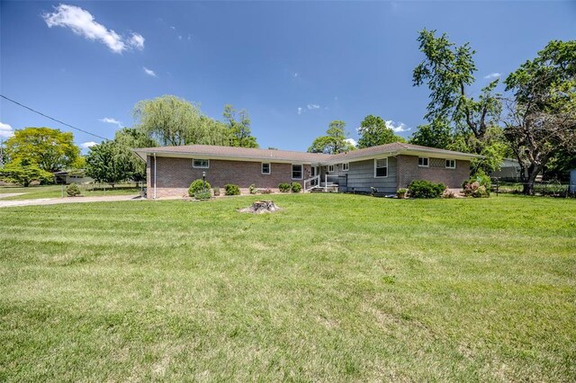 310 Smith Rd, Lebanon, MO 65536 - rear view of property featuring brick siding and a yard