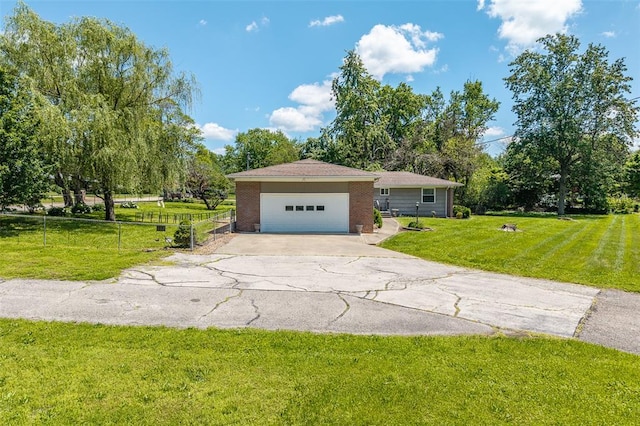 310 Smith Rd, Lebanon, MO 65536 - view of front facade featuring a garage and asphalt driveway