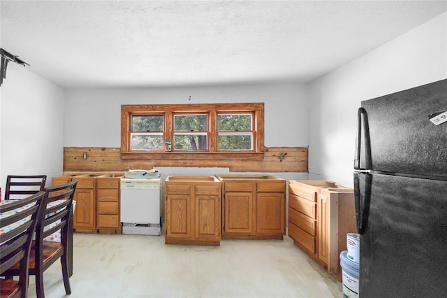 6 Clay St, Park Hills, MO 63601 - kitchen with freestanding refrigerator and brown cabinetry