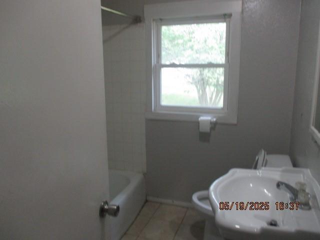 16 Richardson Dr, Union, MO 63084 - bathroom featuring a sink, tile patterned floors, healthy amount of natural light, and baseboards