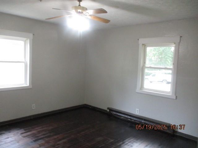 16 Richardson Dr, Union, MO 63084 - empty room with ceiling fan and dark wood-style floors