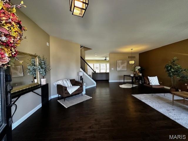 2001 Paul Renaud Blvd, Lake St Louis, MO 63367 - living area featuring wood finished floors, baseboards, and stairs