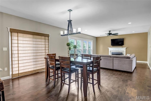 2001 Paul Renaud Blvd, Lake St Louis, MO 63367 - dining space with dark wood-style floors, ceiling fan, a fireplace, baseboards, and recessed lighting