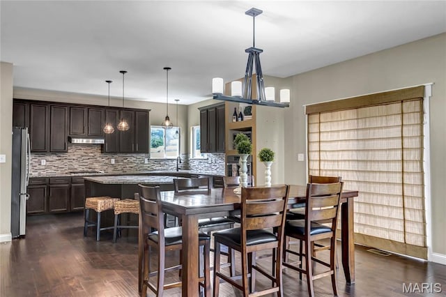 2001 Paul Renaud Blvd, Lake St Louis, MO 63367 - dining area with dark wood finished floors and baseboards