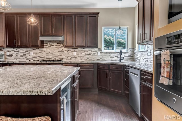 2001 Paul Renaud Blvd, Lake St Louis, MO 63367 - kitchen with appliances with stainless steel finishes, a sink, dark brown cabinets, and light stone countertops