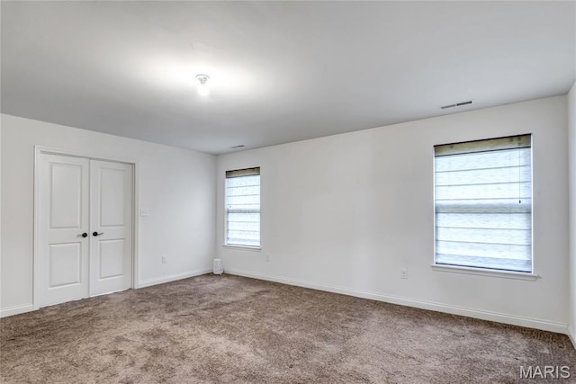 2001 Paul Renaud Blvd, Lake St Louis, MO 63367 - unfurnished bedroom with carpet, baseboards, and a closet