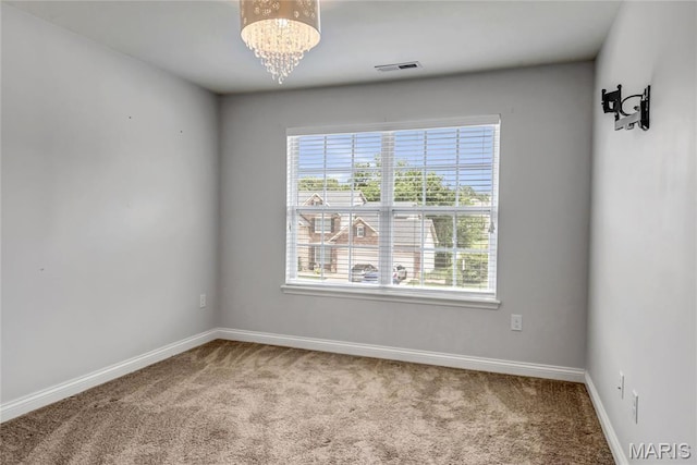 2001 Paul Renaud Blvd, Lake St Louis, MO 63367 - unfurnished room featuring carpet, baseboards, and a chandelier