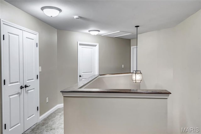 2001 Paul Renaud Blvd, Lake St Louis, MO 63367 - kitchen featuring light colored carpet, baseboards, and hanging light fixtures