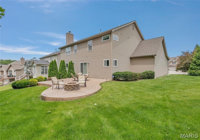 2001 Paul Renaud Blvd, Lake St Louis, MO 63367 - back of house featuring a patio, an outdoor fire pit, and a yard