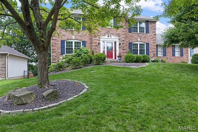 139 Foxtail Dr, Frontier Township, MO 63303 - colonial inspired home with brick siding and a front lawn