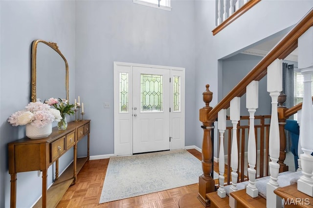 139 Foxtail Dr, Frontier Township, MO 63303 - entryway featuring healthy amount of natural light, a high ceiling, baseboards, and stairs