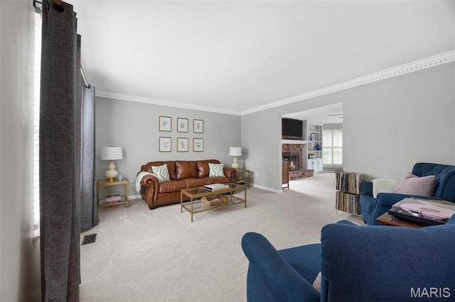 139 Foxtail Dr, Frontier Township, MO 63303 - living area with carpet flooring, crown molding, a brick fireplace, and baseboards