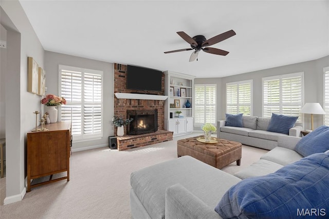 139 Foxtail Dr, Frontier Township, MO 63303 - living area featuring healthy amount of natural light, ceiling fan, a brick fireplace, and carpet floors