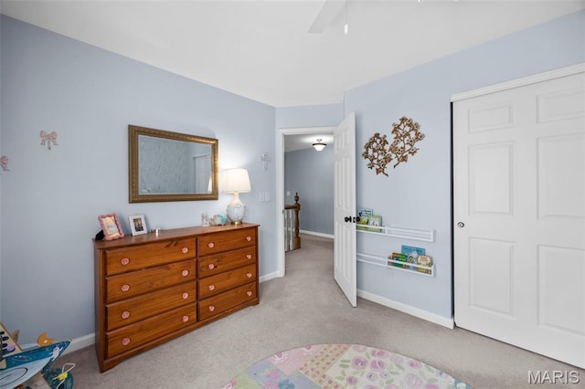 139 Foxtail Dr, Frontier Township, MO 63303 - carpeted bedroom with baseboards, a closet, and a ceiling fan