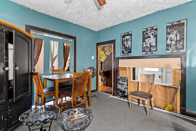 4615 San Francisco Ave, Saint Louis, MO 63115 - carpeted dining room with a textured ceiling and ceiling fan