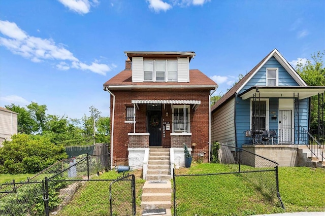 4615 San Francisco Ave, Saint Louis, MO 63115 - bungalow-style house with a porch, brick siding, and a fenced front yard