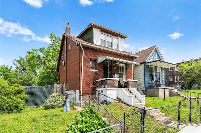 4615 San Francisco Ave, Saint Louis, MO 63115 - view of front facade featuring a gate, a chimney, a porch, brick siding, and a fenced backyard