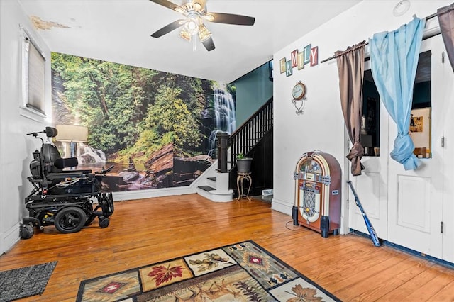 4615 San Francisco Ave, Saint Louis, MO 63115 - living room with hardwood / wood-style flooring, ceiling fan, and stairway