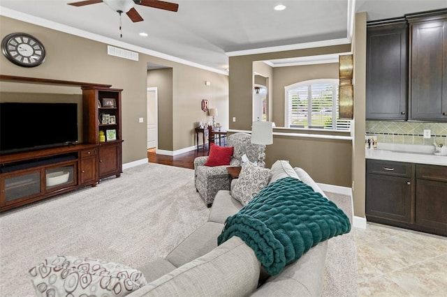 1514 Autumn St, Godfrey, IL 62035 - living area with ceiling fan, crown molding, baseboards, light colored carpet, and recessed lighting