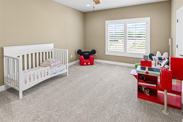 1514 Autumn St, Godfrey, IL 62035 - carpeted bedroom with baseboards and a crib