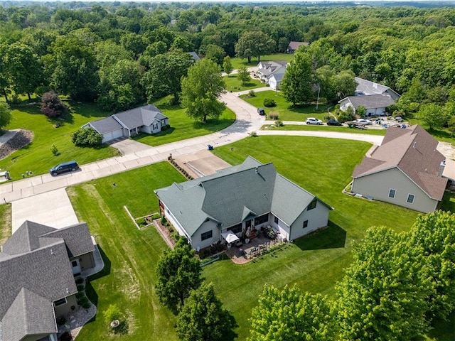 205 Hickman Dr, Bowling Green, MO 63334 - aerial perspective of suburban area with a heavily wooded area