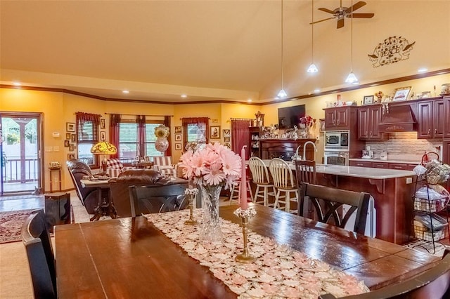 205 Hickman Dr, Bowling Green, MO 63334 - dining space with ornamental molding, vaulted ceiling, healthy amount of natural light, ceiling fan, and recessed lighting
