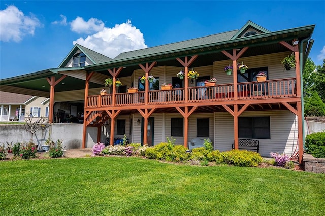 205 Hickman Dr, Bowling Green, MO 63334 - back of house featuring a lawn and a carport