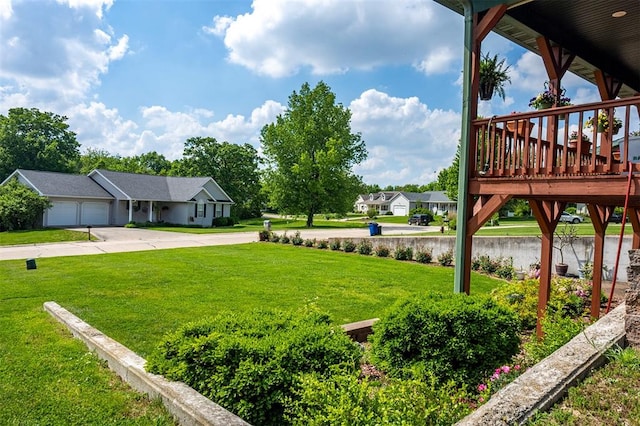 205 Hickman Dr, Bowling Green, MO 63334 - view of grassy yard with a water view, driveway, and an attached garage