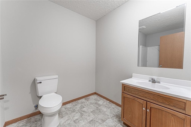 26805 Stephanie Ln, Laquey, MO 65534 - bathroom featuring a textured ceiling, vanity, toilet, and baseboards