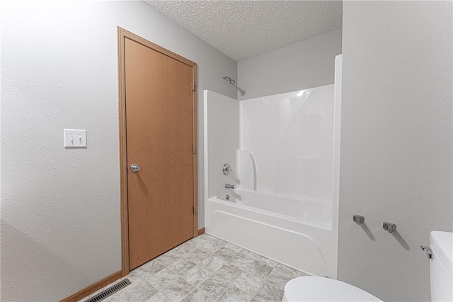 26805 Stephanie Ln, Laquey, MO 65534 - full bathroom featuring toilet, shower / bathtub combination, a textured ceiling, and a textured wall