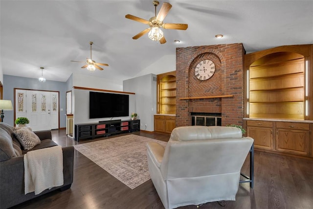 3 Jura Ct, Ofallon, MO 63368 - living room featuring ceiling fan, dark wood-type flooring, a fireplace, built in features, and vaulted ceiling