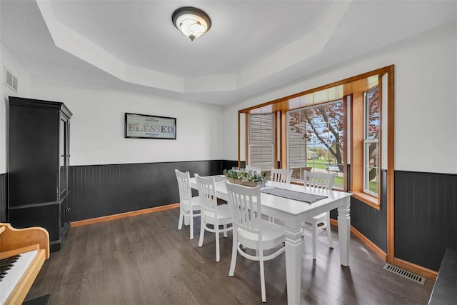 3 Jura Ct, Ofallon, MO 63368 - dining space with a raised ceiling, wainscoting, dark wood finished floors, and baseboards