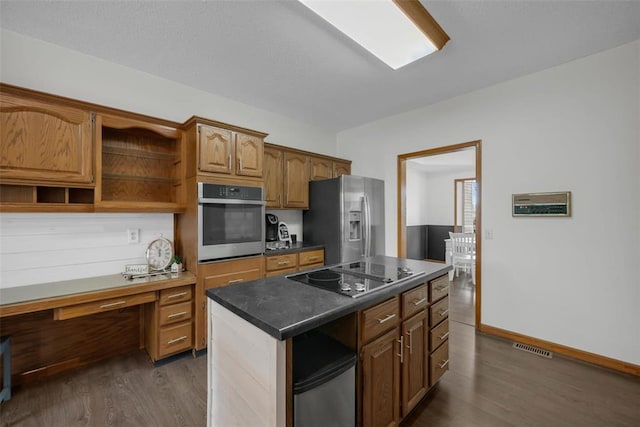 3 Jura Ct, Ofallon, MO 63368 - kitchen with stainless steel appliances, dark wood finished floors, open shelves, a center island, and baseboards