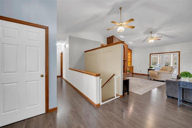 3 Jura Ct, Ofallon, MO 63368 - corridor with an upstairs landing, lofted ceiling, dark wood-style flooring, and baseboards