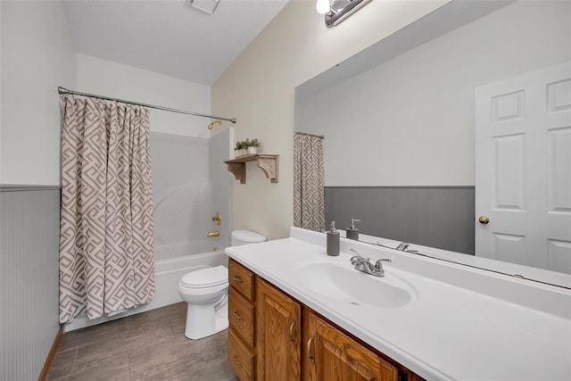 3 Jura Ct, Ofallon, MO 63368 - bathroom with toilet, vanity, shower / tub combo with curtain, and wainscoting