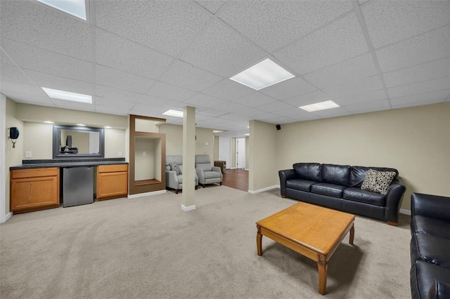 3 Jura Ct, Ofallon, MO 63368 - living room featuring a paneled ceiling, light colored carpet, baseboards, and bar area