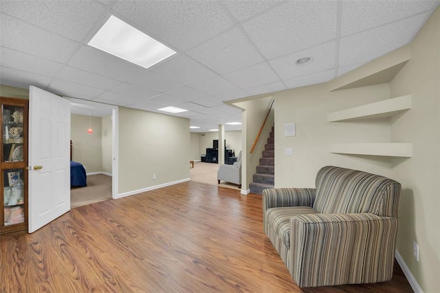 3 Jura Ct, Ofallon, MO 63368 - sitting room with a paneled ceiling, stairs, wood finished floors, and baseboards