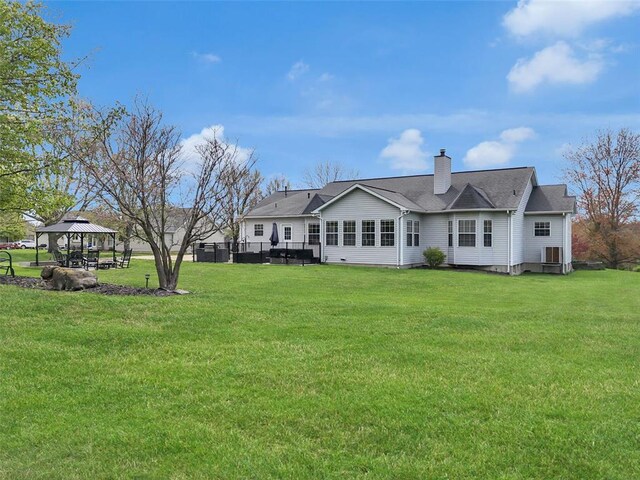 3 Jura Ct, Ofallon, MO 63368 - rear view of property with a gazebo, a yard, a chimney, and central AC