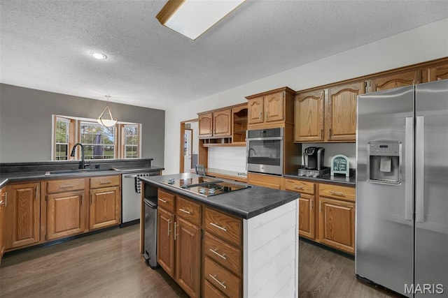 3 Jura Ct, Ofallon, MO 63368 - kitchen featuring appliances with stainless steel finishes, a textured ceiling, dark countertops, open shelves, and dark wood-style flooring