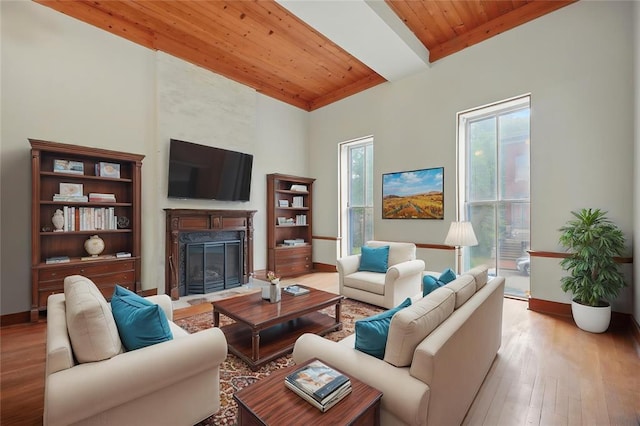 1225 Mackay Pl, Saint Louis, MO 63104 - living area featuring wooden ceiling, a high end fireplace, wood finished floors, baseboards, and a high ceiling