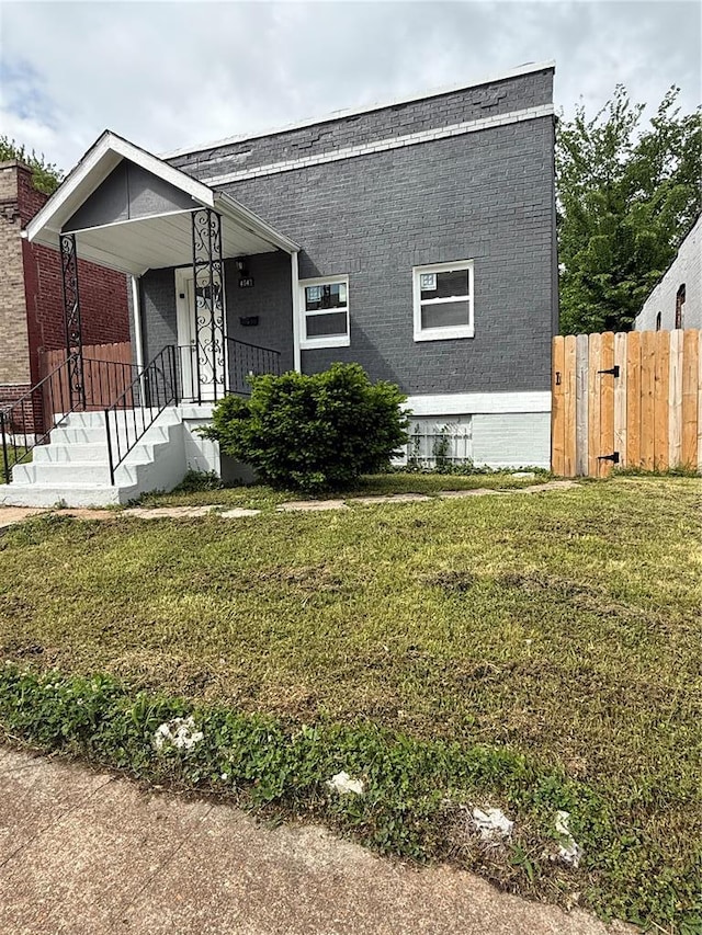 view of front of house featuring brick siding