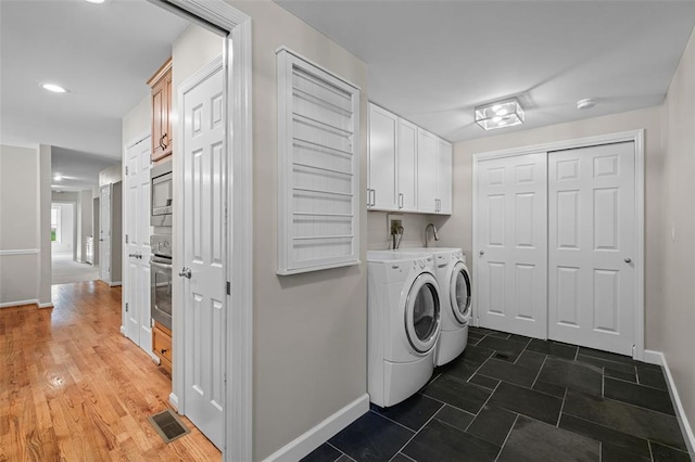 1807 Brookcreek Ln, Kirkwood, MO 63122 - laundry area with cabinet space, washer and clothes dryer, baseboards, and recessed lighting