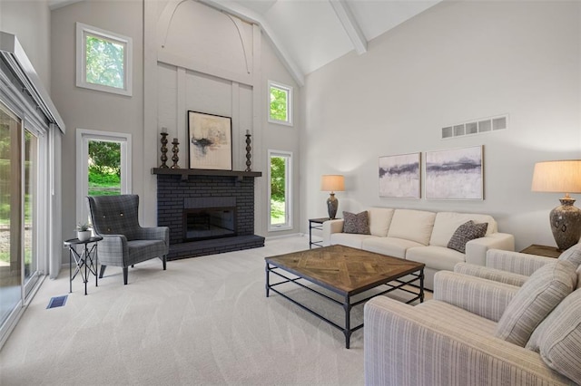 1807 Brookcreek Ln, Kirkwood, MO 63122 - carpeted living room with high vaulted ceiling, plenty of natural light, a brick fireplace, and beamed ceiling