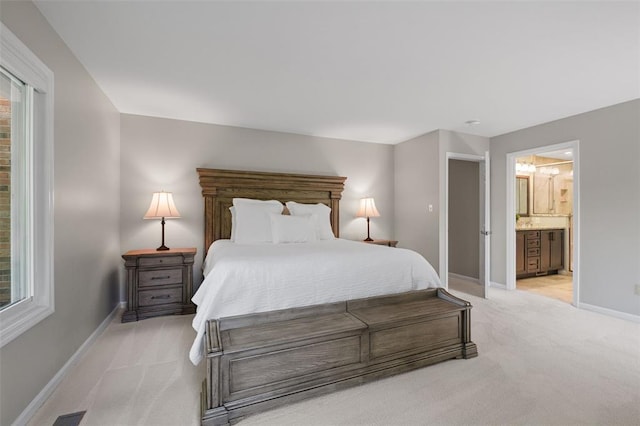 1807 Brookcreek Ln, Kirkwood, MO 63122 - bedroom with light colored carpet, baseboards, and connected bathroom